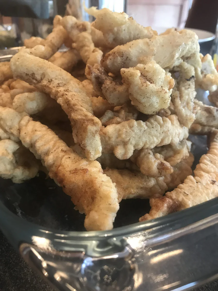 Golden-brown fried fish pieces.