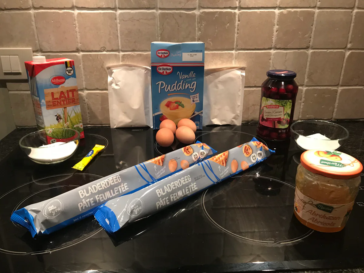 Ingredients for cherry tart on the worktop.