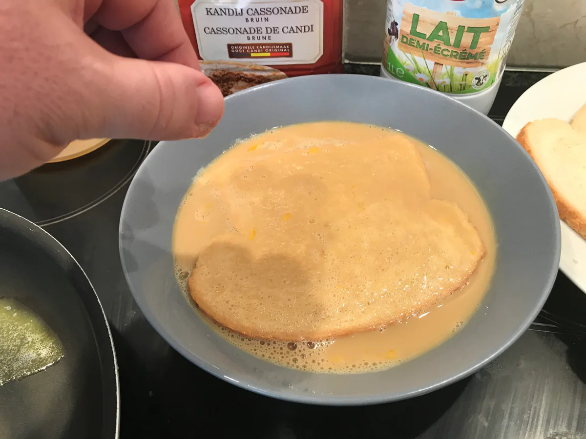 Adding sugar to the bread mixture.