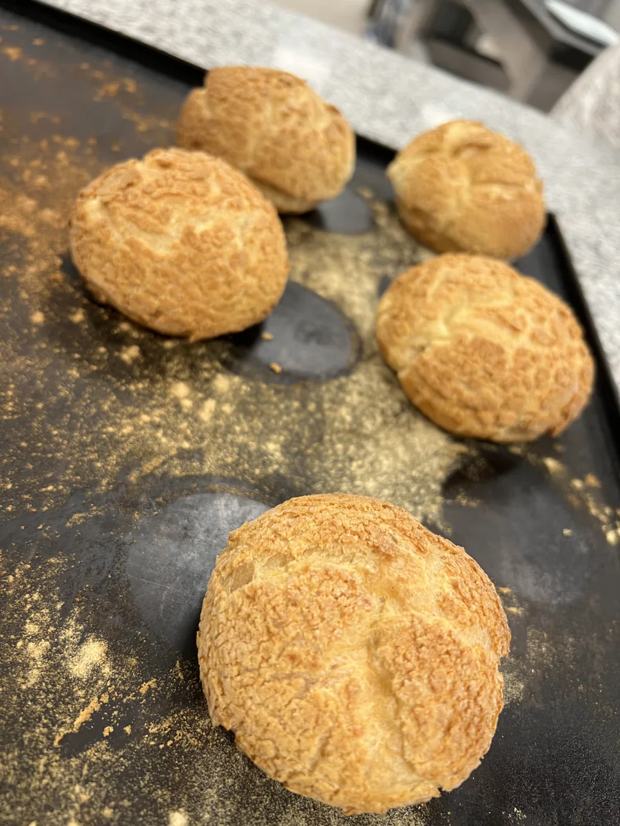Baked choux pastries with a crisp topping.