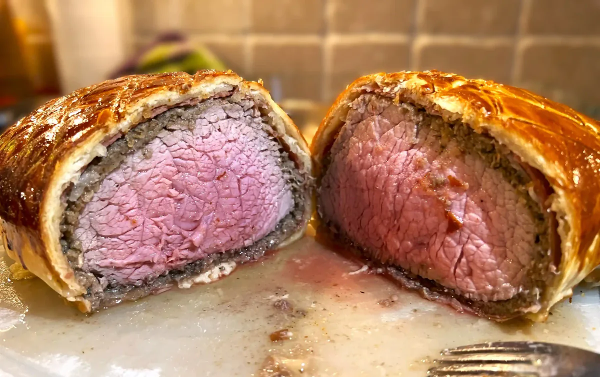 Sliced beef Wellington with a pink centre.