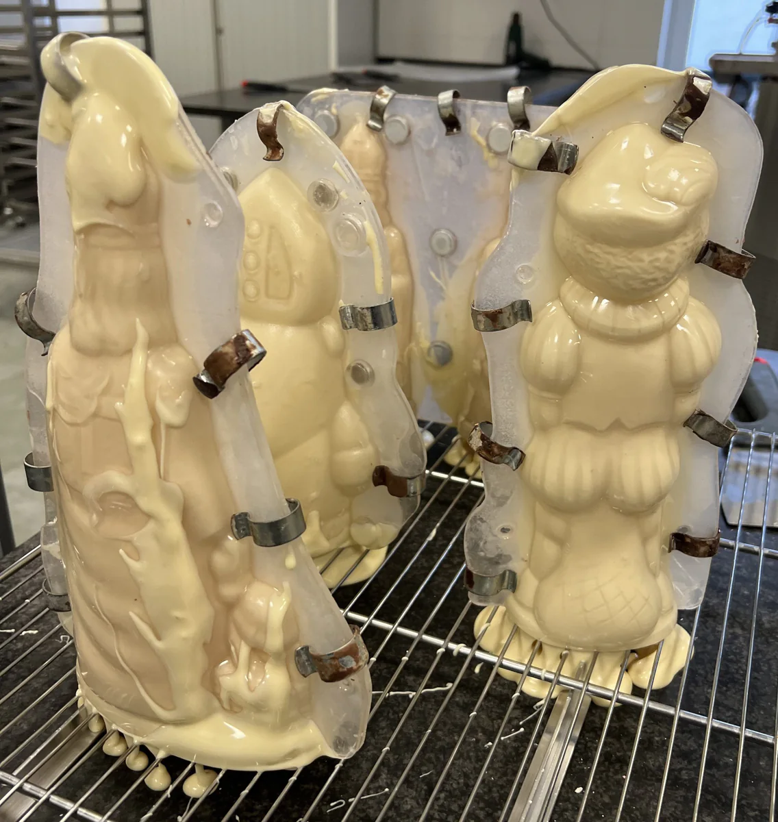 Leaving a Saint Nicholas figure to drain on a rack