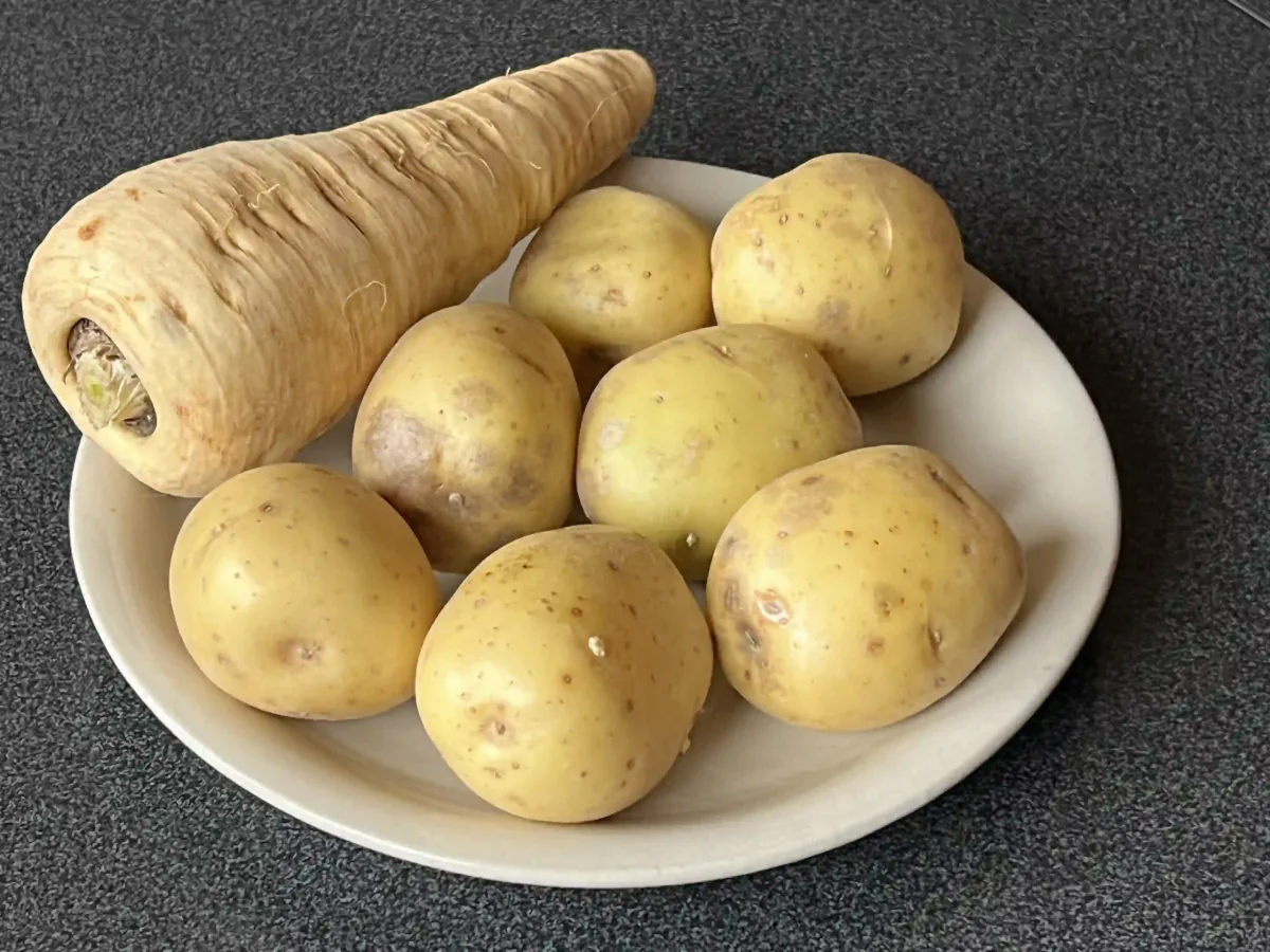 Parsnips and potatoes on a plate.