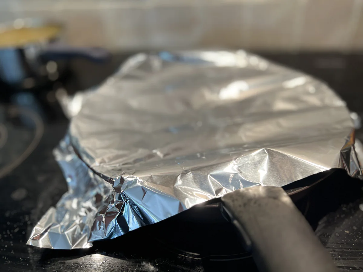 Pan covered with aluminium foil.