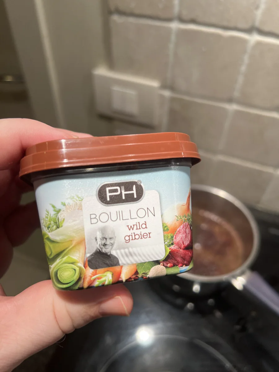 Jar of poultry stock used to make sauce.