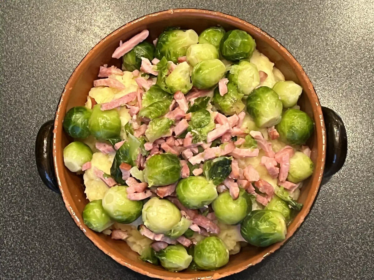Brussels sprout mash with bacon strips, viewed from above