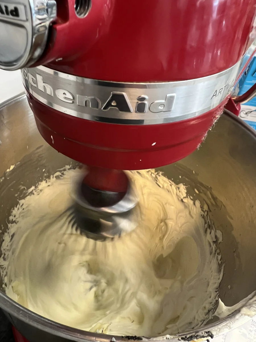 Whipping a pale cream in a stand mixer.