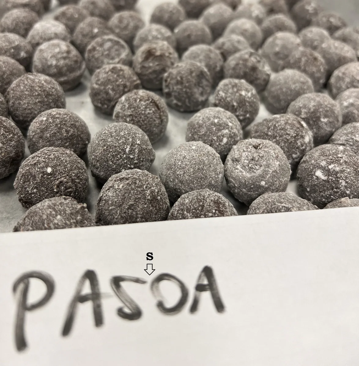 Dark chocolate truffles with Passoã ganache finished with granulated sugar