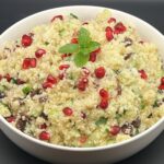Couscous met granaatappel, komkommer en rozijnen